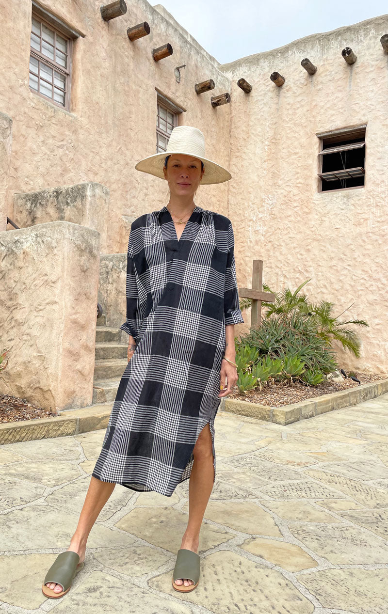 black and cream plaid cotton; not sheer in a two pocket, long sleeve caftan