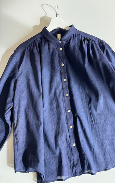 long sleeve button down shirt with a small rounded collar in a lightweight navy with thin blue pinstripe cotton fabric