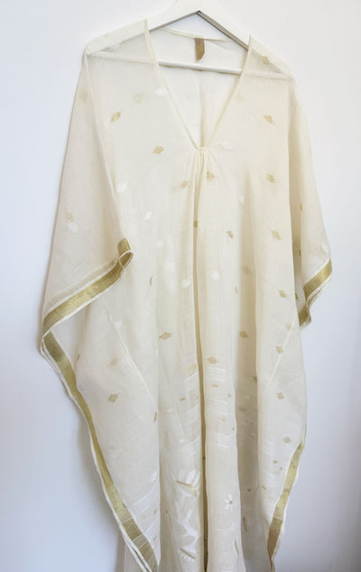 white caftan with gold floral motif